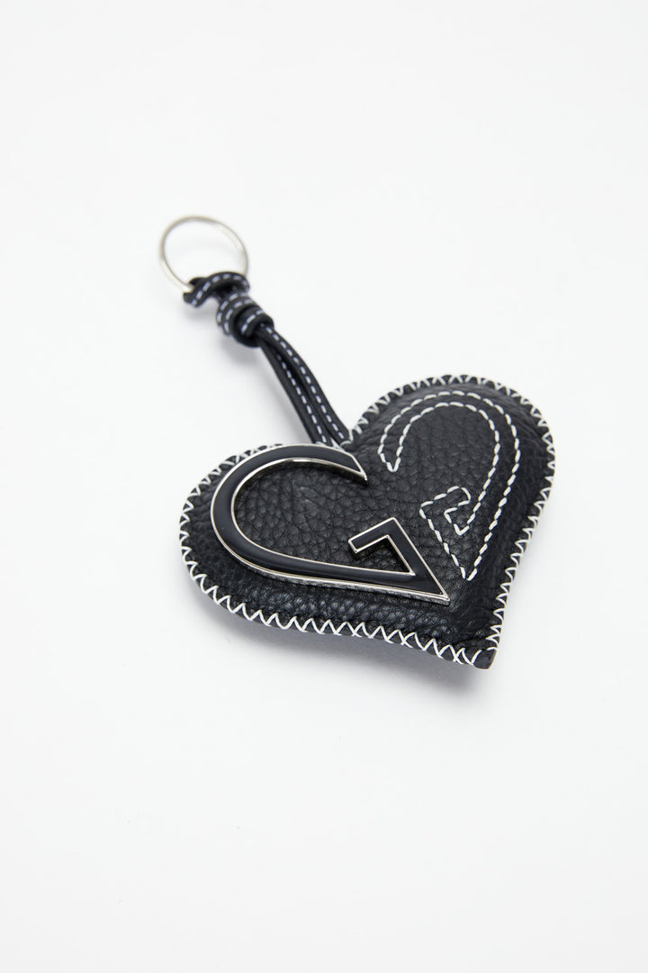 Heart-shaped keychain with a logo on a white background