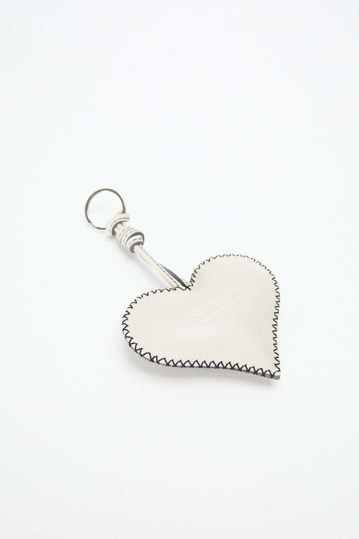 Heart-shaped keychain with a white heart and silver border on a white background