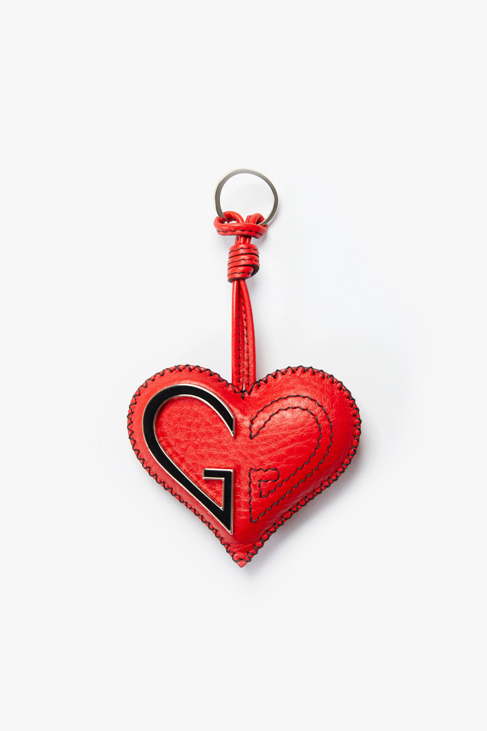 Red heart-shaped keychain with a black logo on a white background