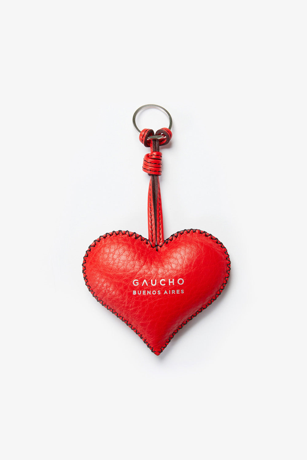 Red heart-shaped keychain with 'Gaucho Buenos Aires' branding on a white background