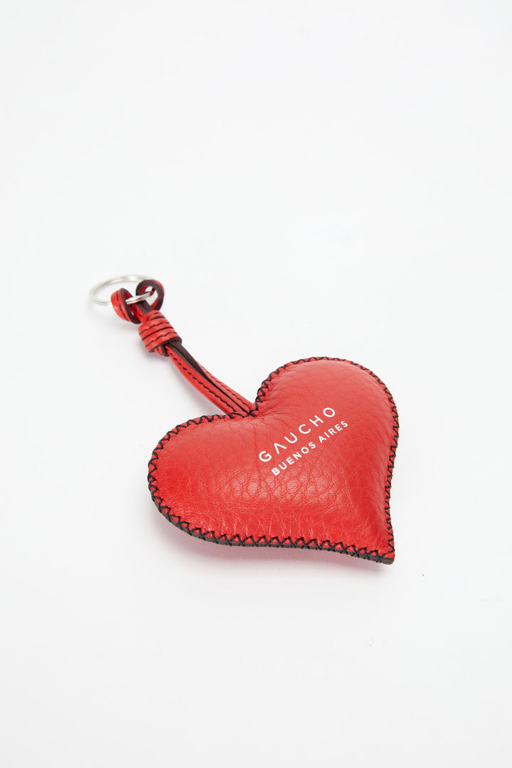 Red heart-shaped keychain with 'Gaucho' branding on a white background