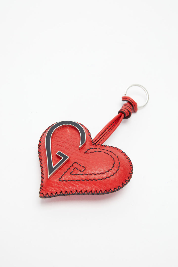 Red heart-shaped keychain with a black outline on a white background