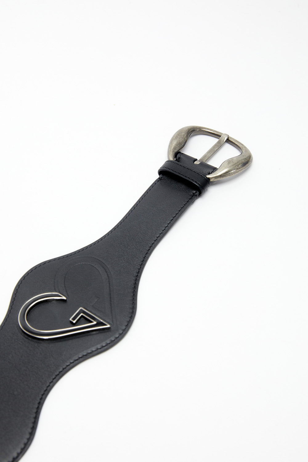 Black leather strap with silver buckle on a white background