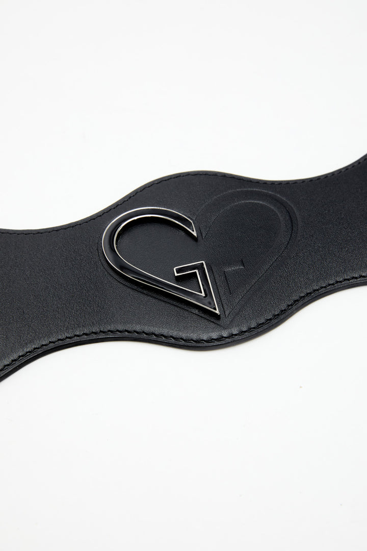 Black leather belt with a heart-shaped buckle on a white background