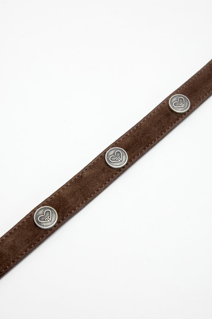 Brown leather belt with silver buttons on a white background