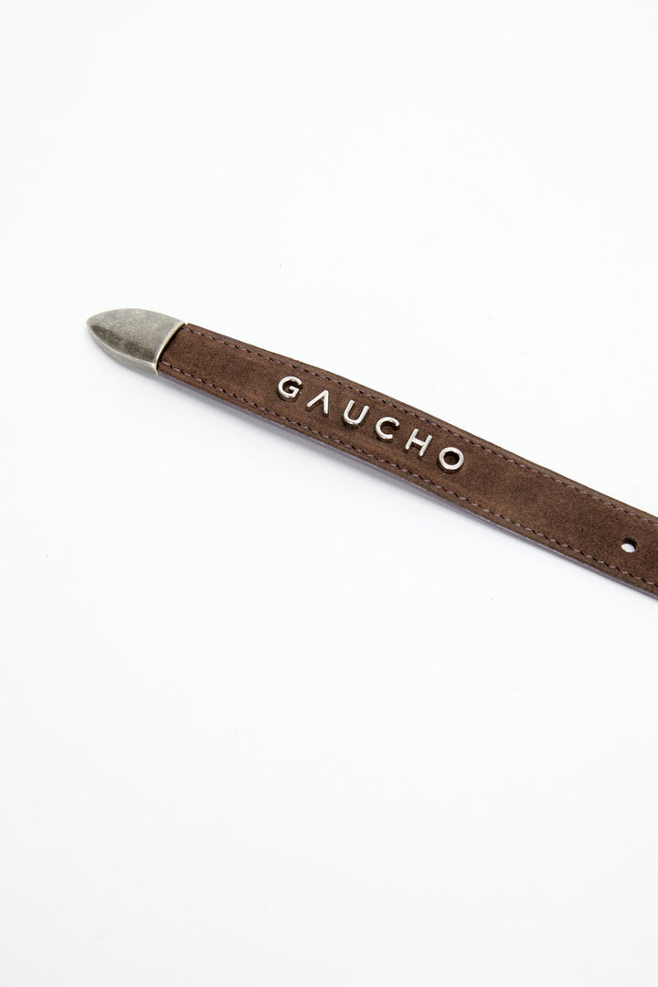 Brown leather belt with 'Gaucho' branding on a white background