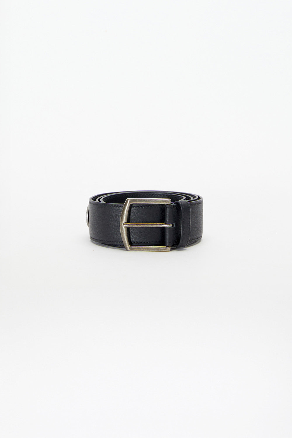 Black belt with a silver buckle on a white background