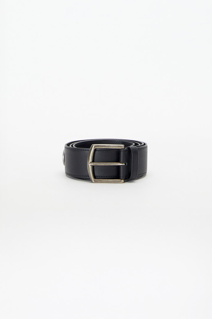 Black belt with a silver buckle on a white background