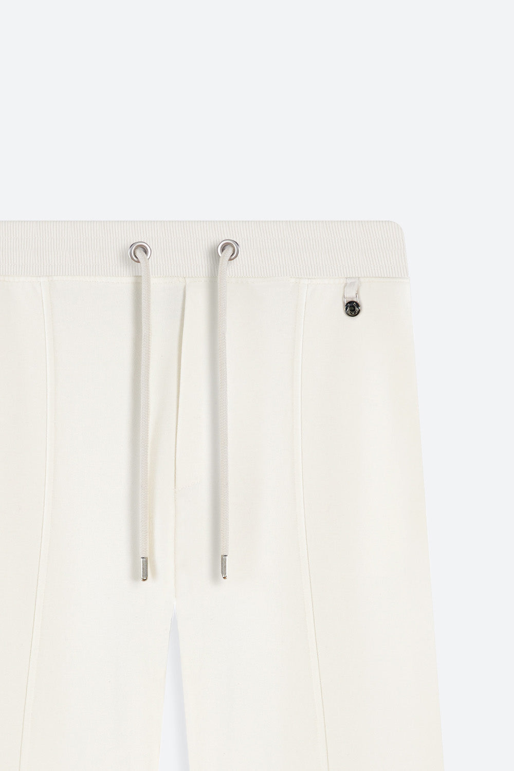 Close-up of a white hoodie with drawstrings on a light gray background