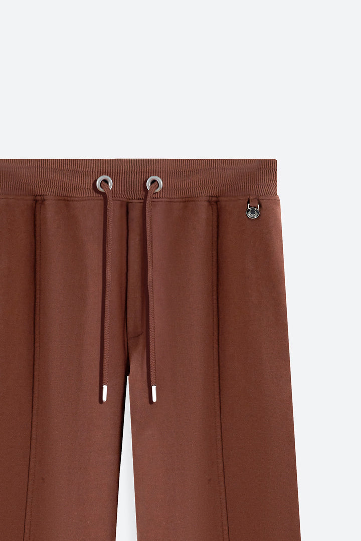 Brown pants with drawstring on a white background