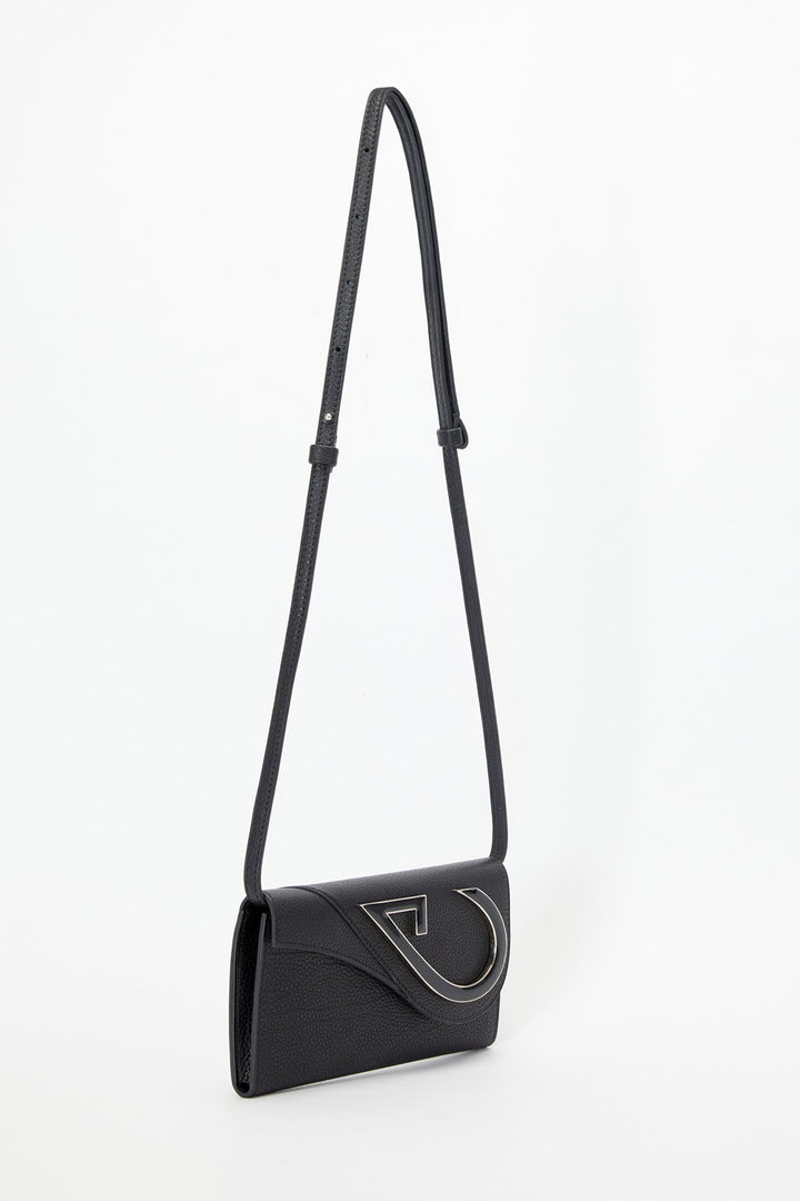 Black handbag with a strap on a white background