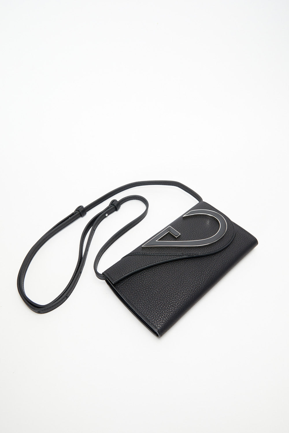 Black leather pouch with a strap on a white background