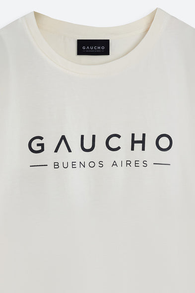 Close-up of a white shirt with 'Gaucho Buenos Aires' text and logo.