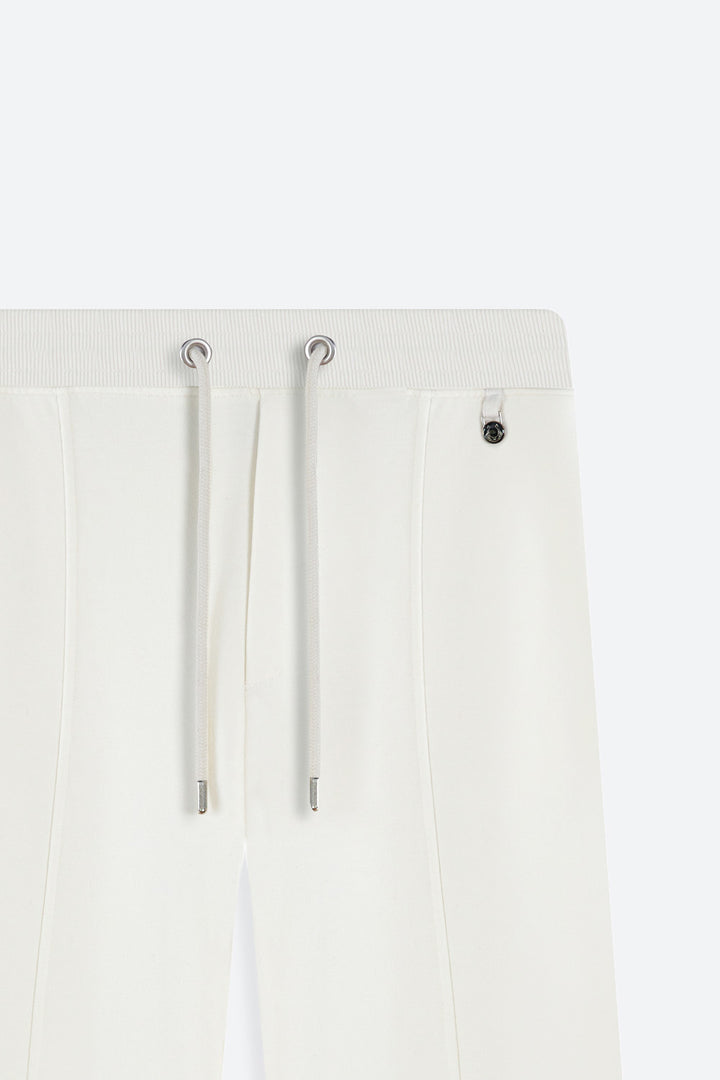White pants with drawstrings on a white background