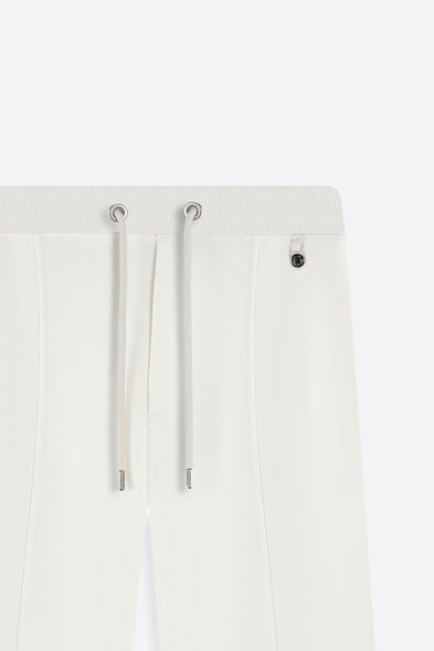White pants with drawstrings on a white background