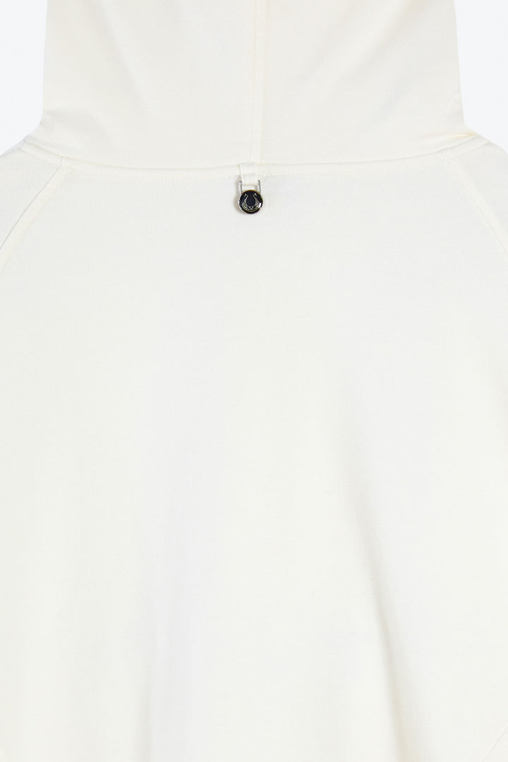 White hoodie with a small black button on a white background
