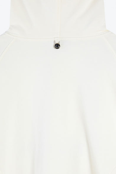 White hoodie with a small black button on a white background