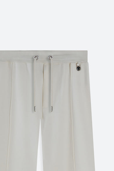 Light gray pants with drawstring and button details on a white background