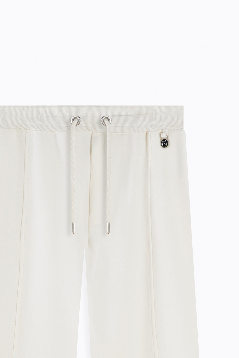 Close-up of a white pants with drawstring on a white background