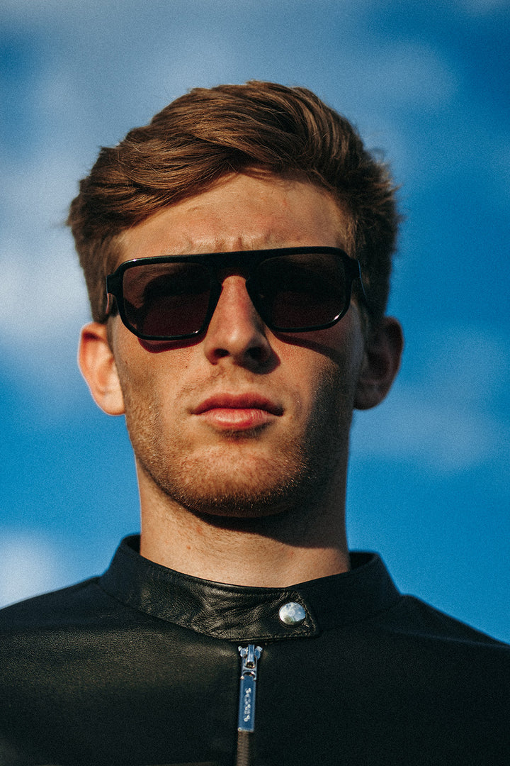 A man wearing Black Gaucho Sunglasses