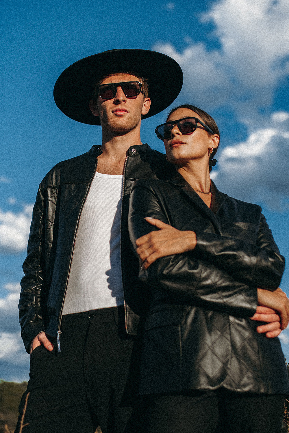 A man and woman wearing Black Gaucho Sunglasses