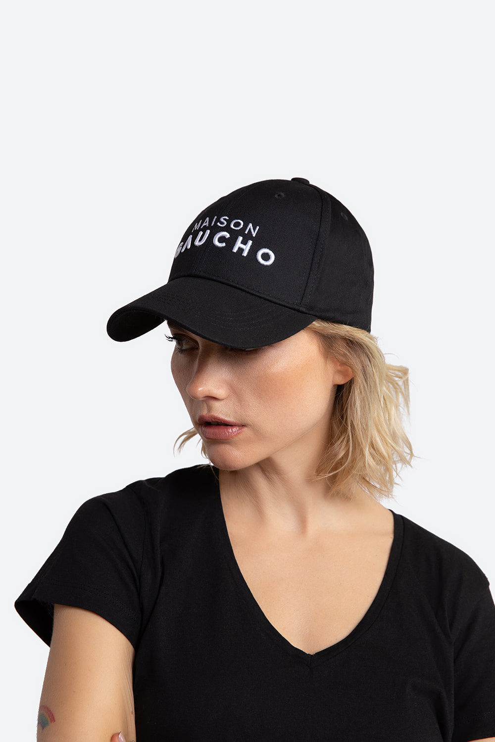 Woman models the Maison Gaucho cap.