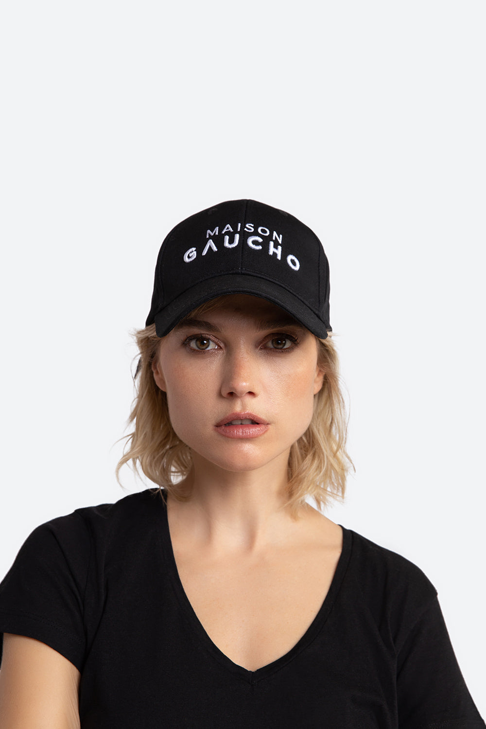 Woman models the Maison Gaucho cap.