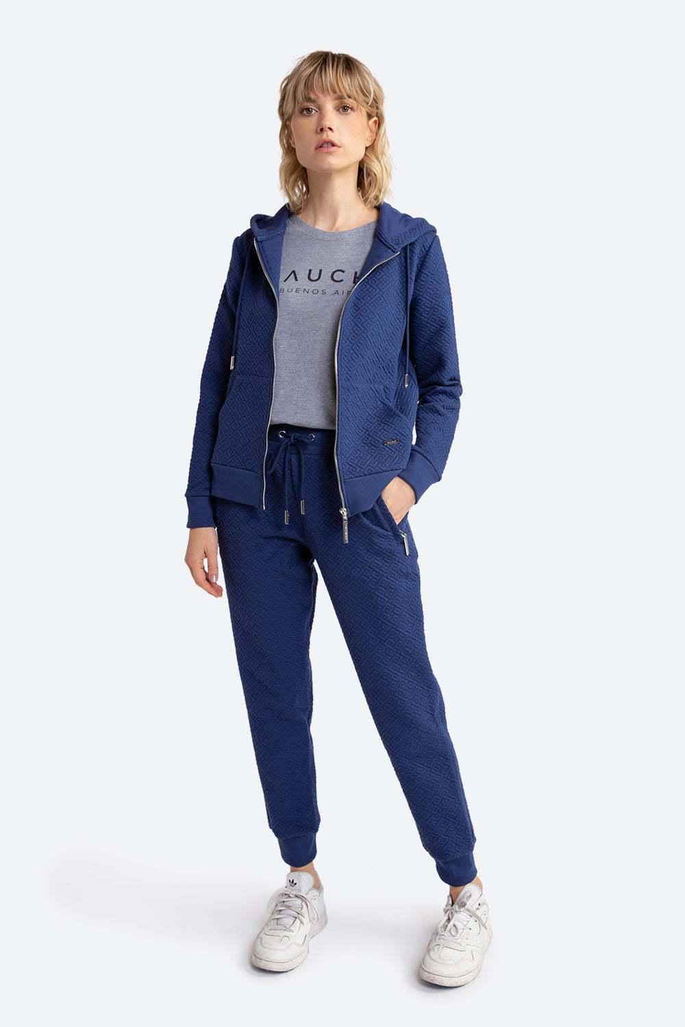 Woman wearing the Belgrano Gaucho Pattern Track Pants in Navy