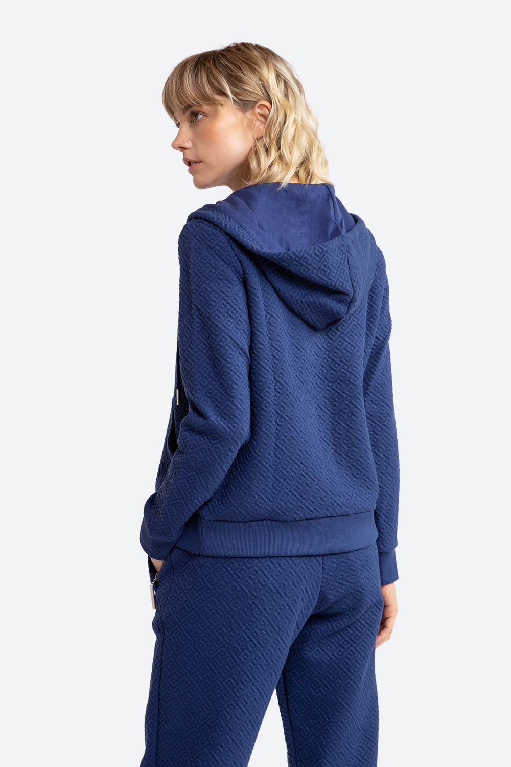 Woman wearing Alsina Gaucho Pattern Zip Hoodie in Navy