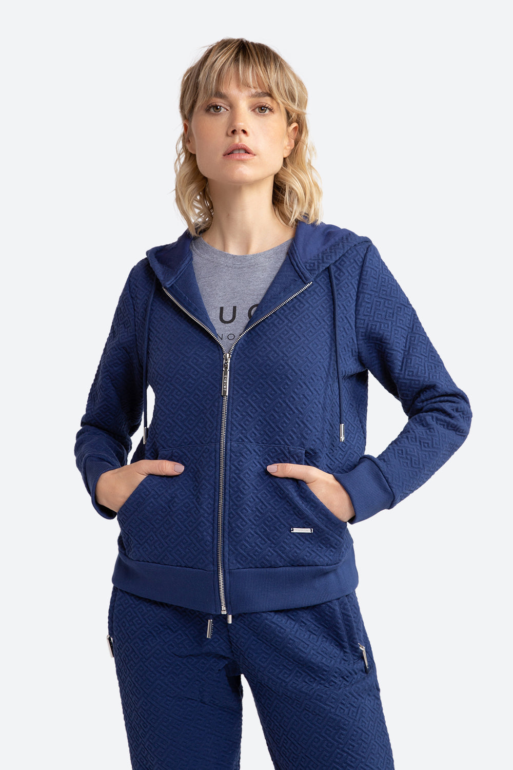 Woman wearing Alsina Gaucho Pattern Zip Hoodie in Navy