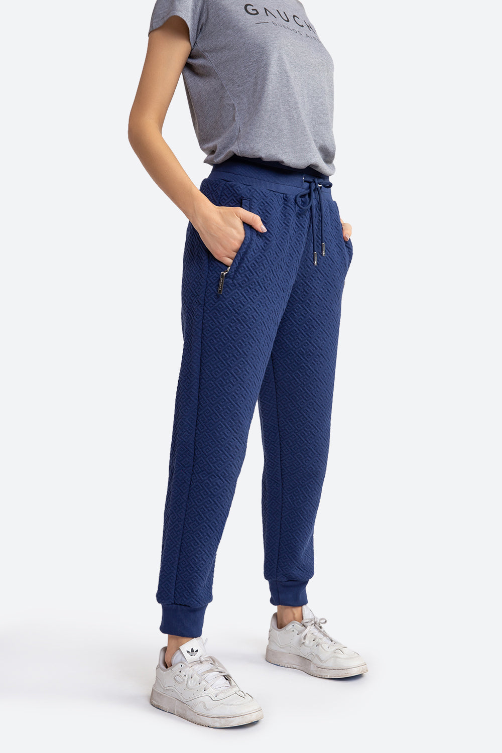 Woman wearing the Belgrano Gaucho Pattern Track Pants in Navy