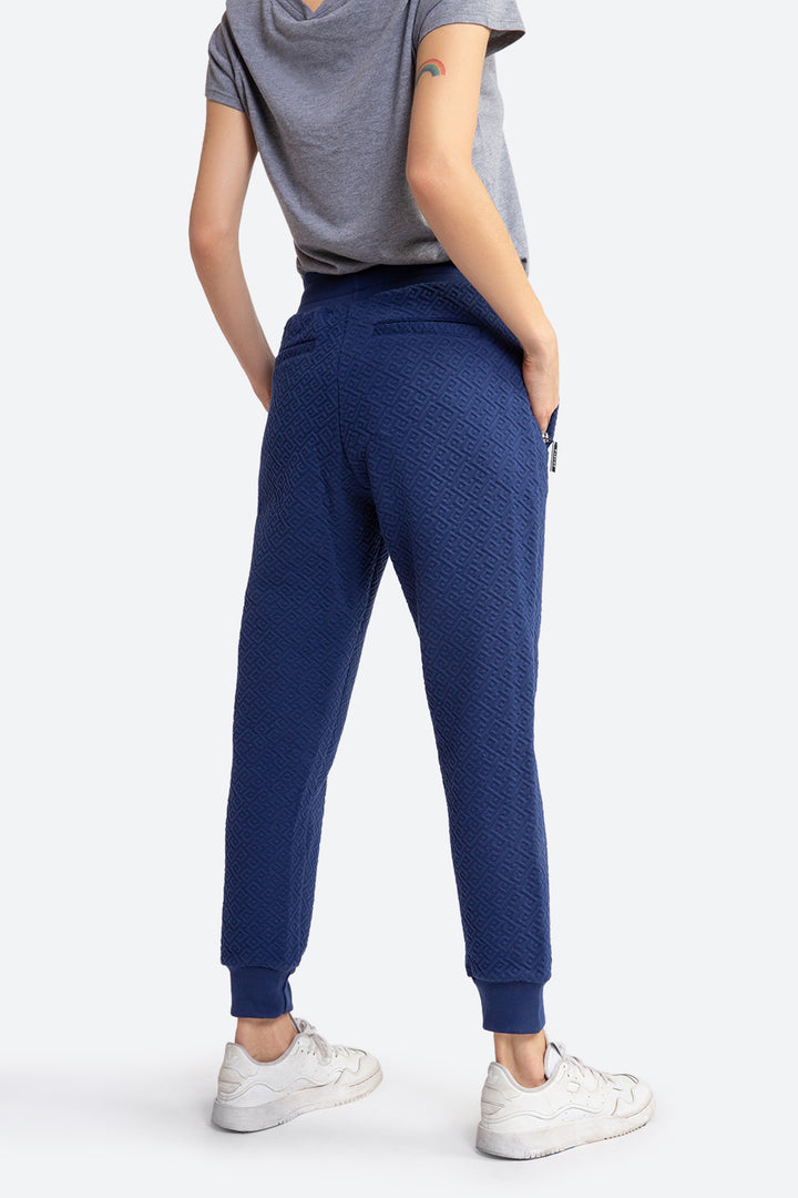 Woman wearing the Belgrano Gaucho Pattern Track Pants in Navy